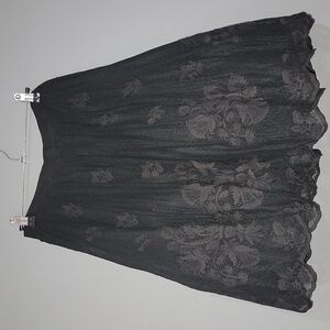 Beautiful black skirt with a light lace print
